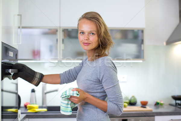 Senior woman cooking in the kitchen - eating and cooking healthy Stock photo © lightpoet