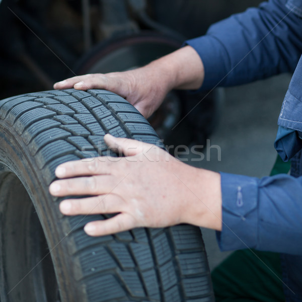 mechanic changing a wheel of a modern car (color toned image) Stock photo © lightpoet