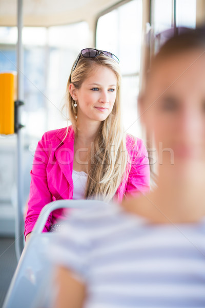 Pretty, young woman on a streetcar/tramway Stock photo © lightpoet