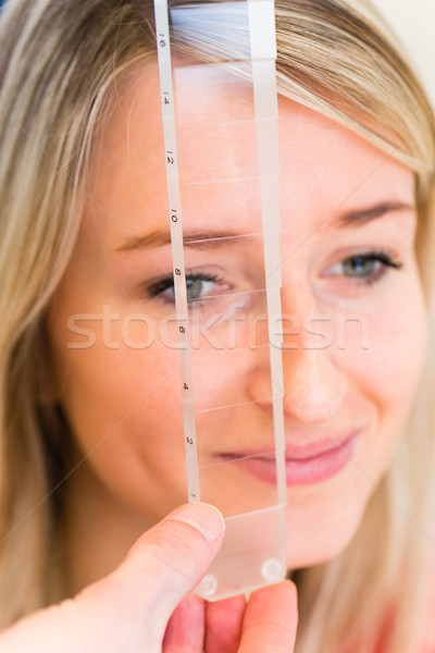 Optometry concept - pretty young woman having her eyes examined  Stock photo © lightpoet