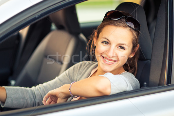 [[stock_photo]]: Joli · jeune · femme · conduite · nouvelle · voiture · couleur · image