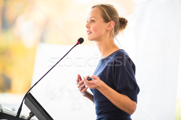 Pretty, young business woman giving a presentation Stock photo © lightpoet