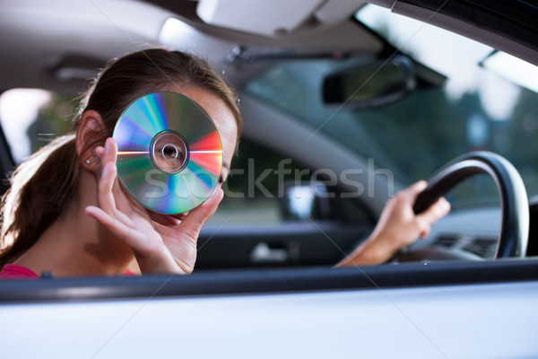 Jóvenes femenino conductor jugando música coche Foto stock © lightpoet
