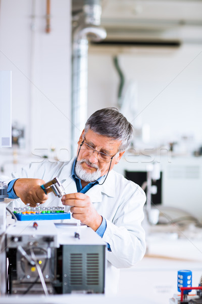 Stock photo: senior male researcher carrying out scientific research in a lab
