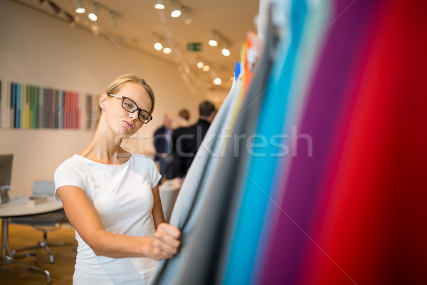 Pretty young woman  choosing the right material/color  Stock photo © lightpoet