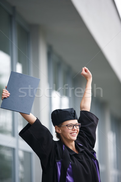 Pretty, young woman celebrating joyfully her graduation Stock photo © lightpoet