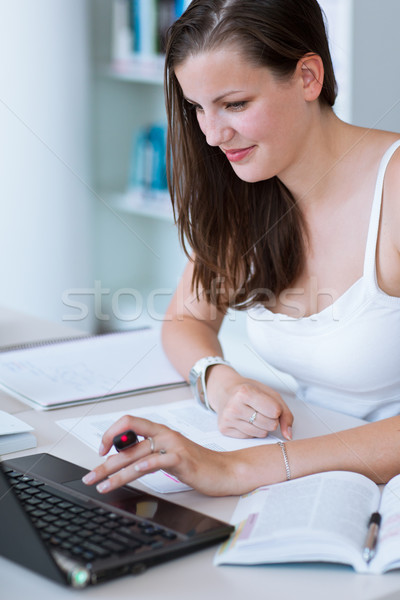 pretty female college student studying in the university library Stock photo © lightpoet
