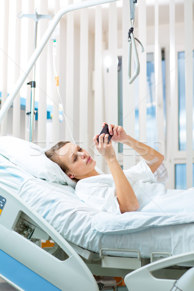 Pretty, young, female patient in a modern hospital room Stock photo © lightpoet