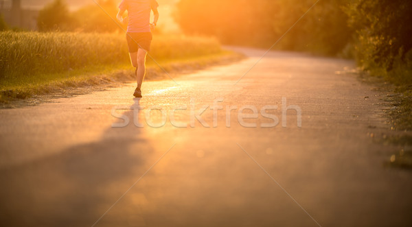 Male athlete/runner running on road  Stock photo © lightpoet