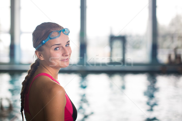 Female swimmer in an indoor swimming pool - going for her swim Stock photo © lightpoet