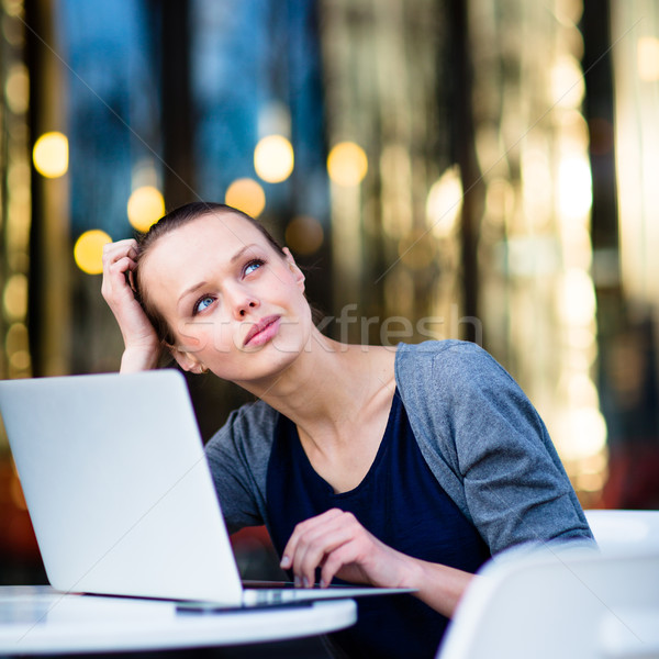 Portrait of a sleek young woman calling on a smartphone  Stock photo © lightpoet