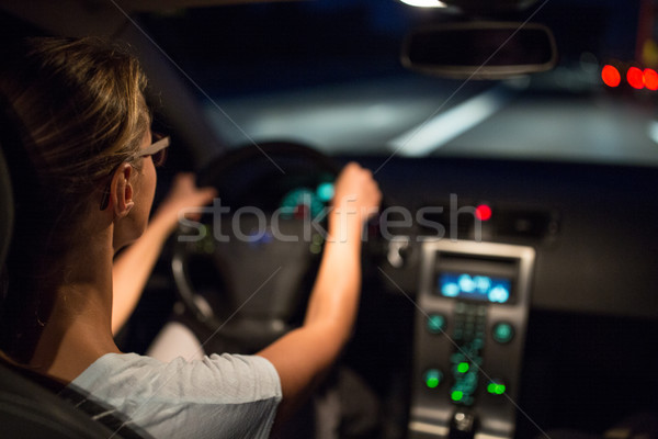 Female drive driving a car at night  Stock photo © lightpoet
