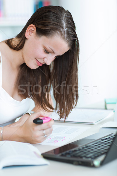 pretty female college student studying in the university library Stock photo © lightpoet