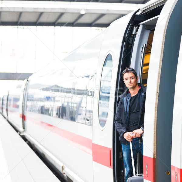 Train travel - Handsome young man taking a train Stock photo © lightpoet