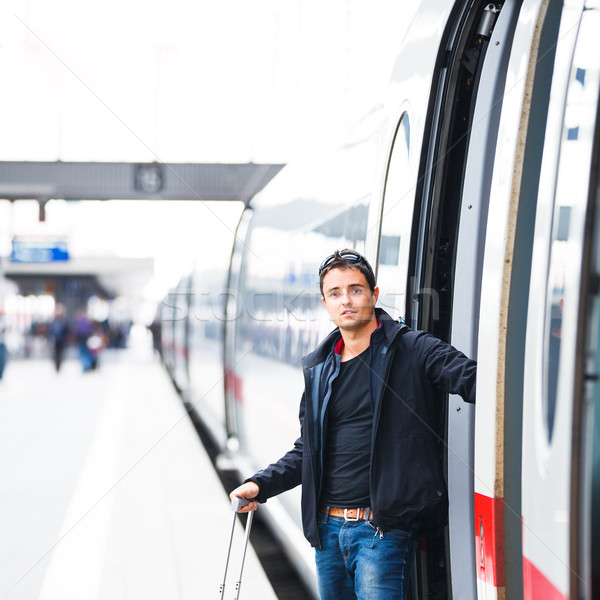 Train travel - Handsome young man taking a train Stock photo © lightpoet