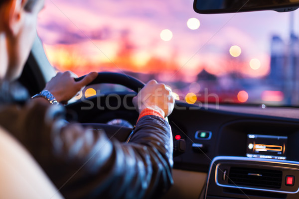 Man driving his modern car at night in a  city Stock photo © lightpoet