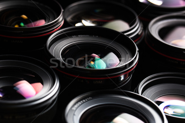 Stock photo: Modern camera lenses with reflections, low key image