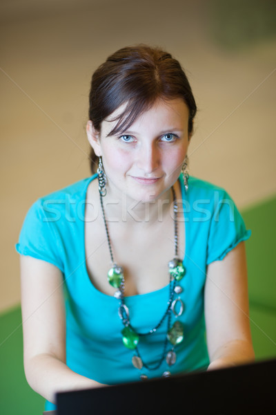 Pretty young female student with laptop on university campus Stock photo © lightpoet