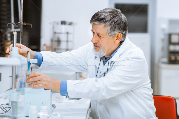 Senior male researcher carrying out scientific research in a lab Stock photo © lightpoet