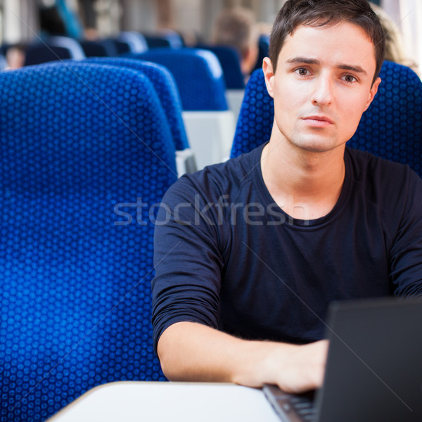 Stock fotó: Jóképű · fiatalember · laptopot · használ · számítógép · vonat · sekély
