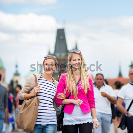 Two female tourists walking along the Charles Bridge Stock photo © lightpoet