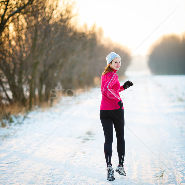  Young woman running outdoors on a cold winter day Stock photo © lightpoet