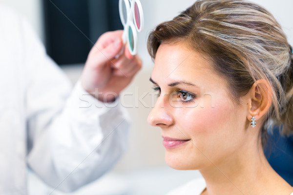 Optometry concept - pretty young woman having her eyes examined  Stock photo © lightpoet