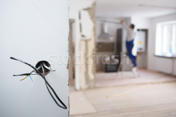 Elektryczne człowiek domu portret pracownika elektrycznej Zdjęcia stock © lightpoet