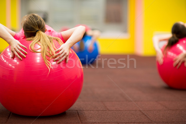 Csoportkép pilates osztály tornaterem fiatal nő fitnessz Stock fotó © lightpoet