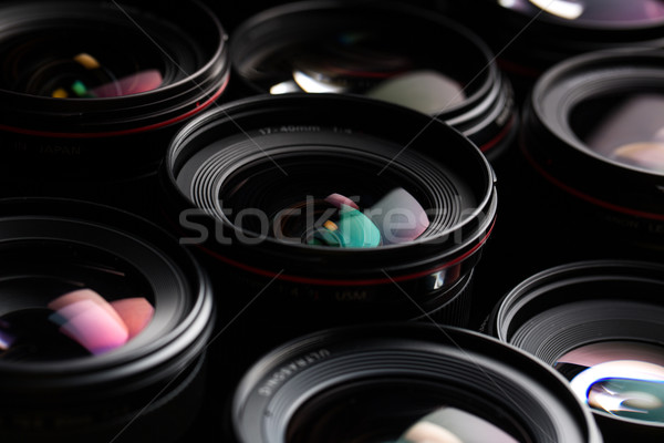 Modern camera lenses with reflections, low key image Stock photo © lightpoet