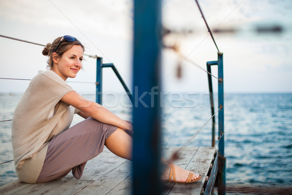 Portrait of a young woman at the seacoast while on vacation Stock photo © lightpoet