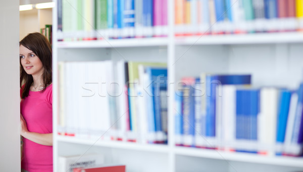 pretty young college student in an university library (shallow D Stock photo © lightpoet
