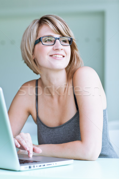 Portrait of a young woman pensively looking out of the window Stock photo © lightpoet