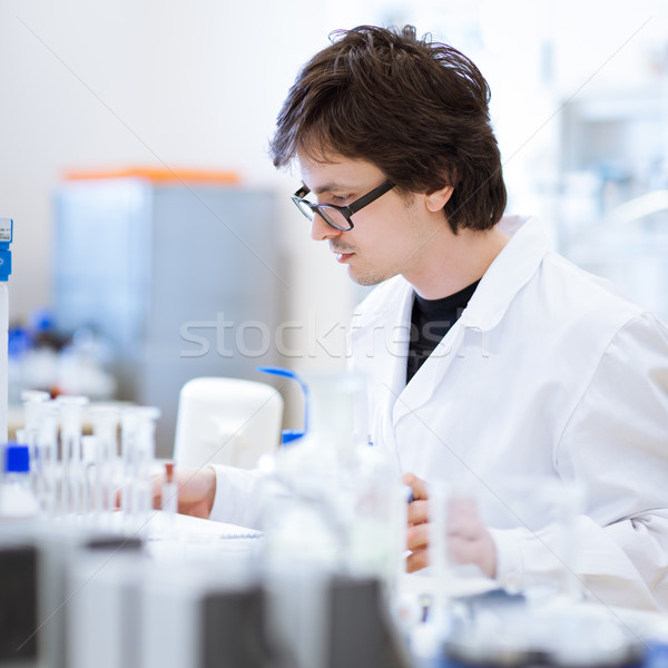 Stock photo: young, male chemistry student  in a lab
