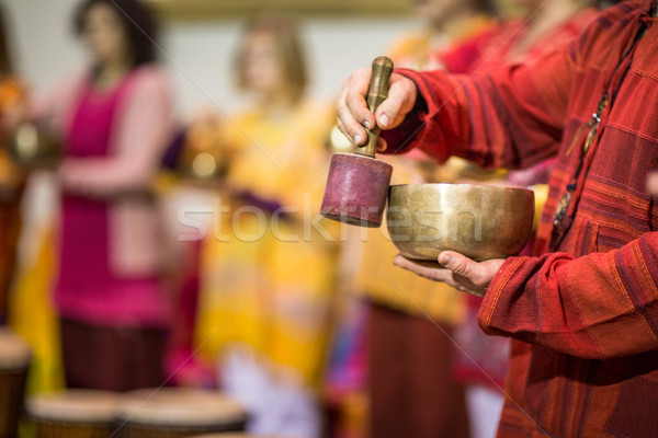 Man playing on a tibetian singing bowl Stock photo © lightpoet