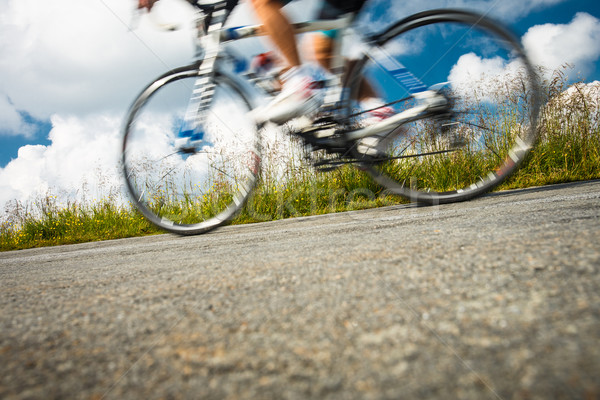 Motion blurred biker on a mountain road Stock photo © lightpoet