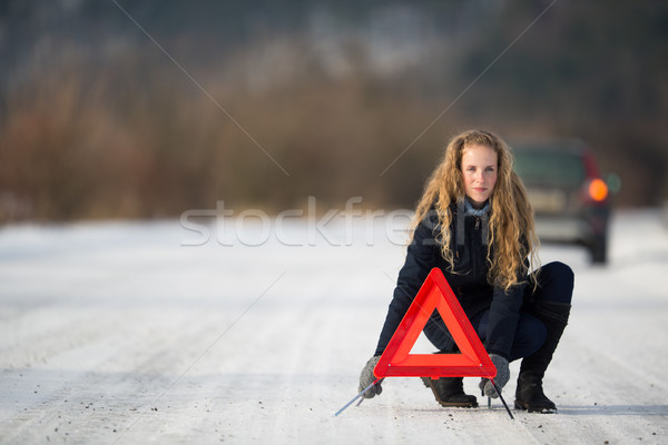 Mulher jovem para cima aviso triângulo chamada Foto stock © lightpoet