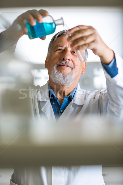 Senior male researcher carrying out scientific research in a lab Stock photo © lightpoet