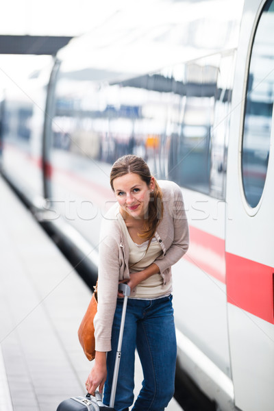 Pretty young woman boarding a train (color toned image) Stock photo © lightpoet