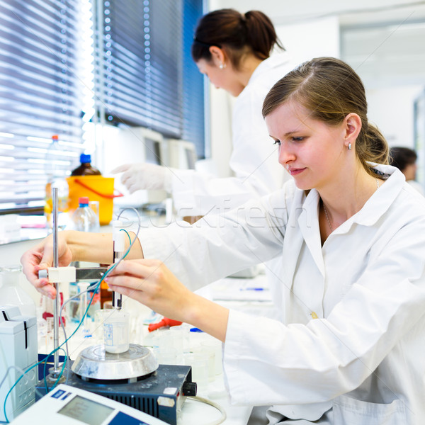 Stock photo: Portrait of a female researcher carrying out research in a chemi