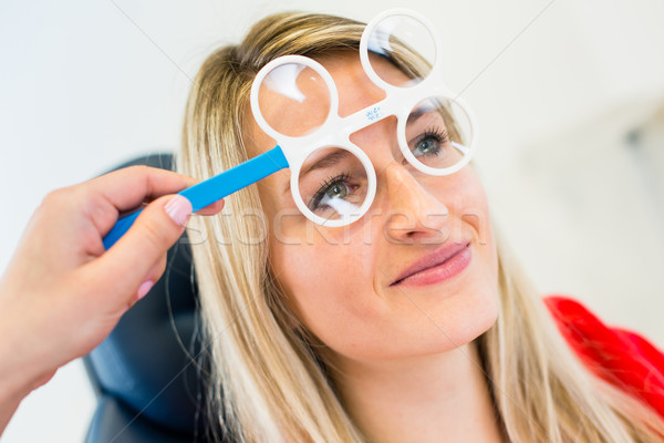 Optometry concept - pretty young woman having her eyes examined  Stock photo © lightpoet