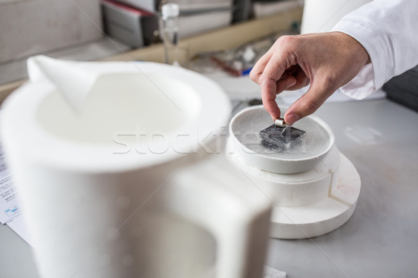 Hands of a scientist working in modern chemistry/physics lab  Stock photo © lightpoet