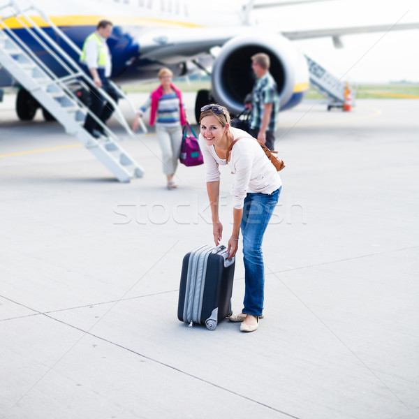 young woman at an airport having just left the aircraft Stock photo © lightpoet