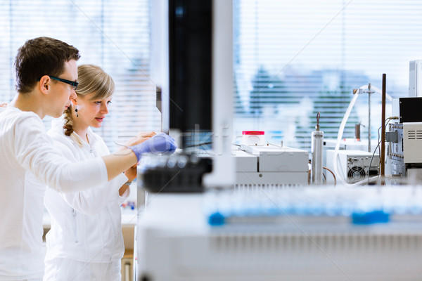 Two young researchers carrying out experiments in a lab (shallow Stock photo © lightpoet