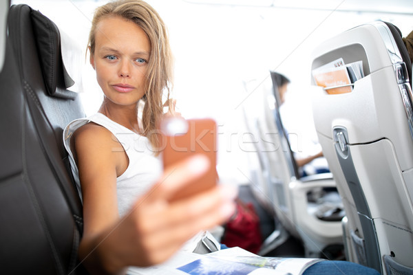 Young happy woman making selfie photo with passport document Stock photo © lightpoet