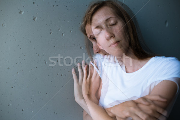 Mulher jovem sofrimento cor imagem dobrar exposição Foto stock © lightpoet