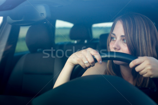 Cute teenager driving her brand new car Stock photo © lightpoet