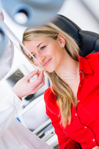 Optometry concept - pretty young woman having her eyes examined  Stock photo © lightpoet