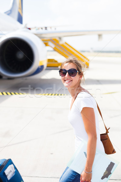 Kalkış genç kadın havaalanı tahta uçak güneşli Stok fotoğraf © lightpoet