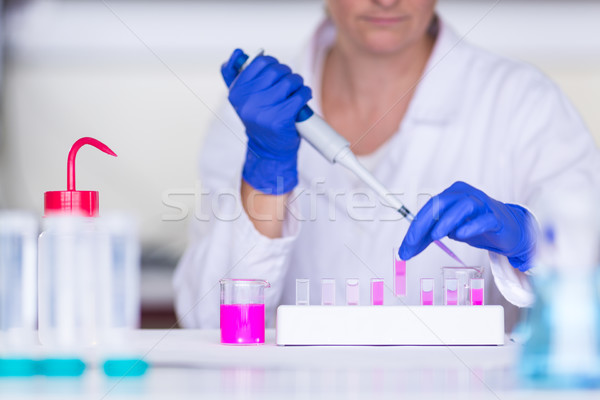 Stock photo: Hands of a female researcher carrying out research in a lab
